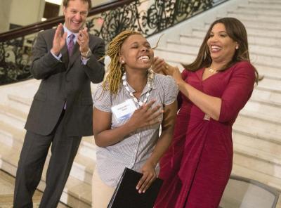 Comcast scholar: Comcast’s Steve Hackley and NECN anchor  Latoyia Edwards celebrated with Dorchester’s Marianna McNeil, winner of a surprise scholarship. Bill Brett photo